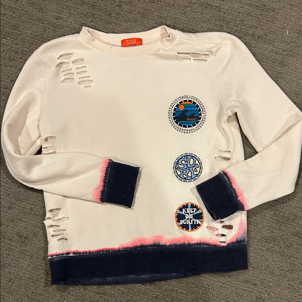 Butter like new girls size 8/10 Cream Distressed Sweatshirt with Patches